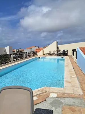 a large swimming pool on the roof of a building at Patio Antigo 218 in Santa Maria
