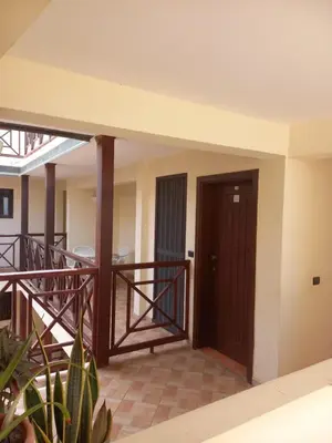 a room with a balcony with a wooden door at Patio Antigo 218 in Santa Maria