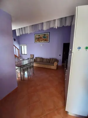 a living room with a couch and a table at Patio Antigo 218 in Santa Maria