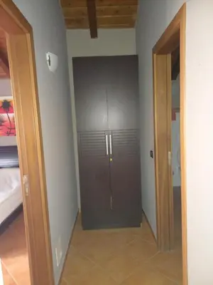 a closet in a room with a door at Patio Antigo 218 in Santa Maria