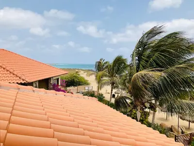 an orange roof of a house next to a beach at Apartment Terrace - front sea view From - May till September in Santa Maria
