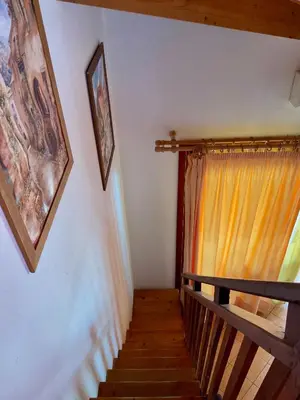 a staircase in a house with a curtain at Apartment Terrace - front sea view From - May till September in Santa Maria
