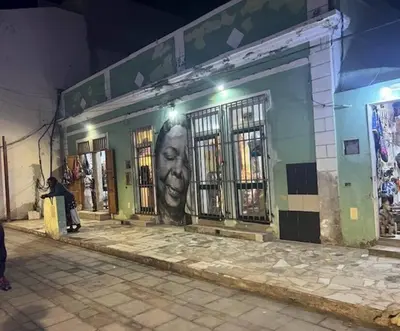 a building with a face painted on the side of it at NEW Luxury Condo - In the heart of Santa Maria in Santa Maria