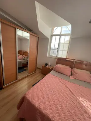 a bedroom with a bed and a large mirror at Casa Mendes- Quarto Casal in Praia