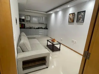 a living room with a couch and a table at Casa Mendes- Quarto Casal in Praia