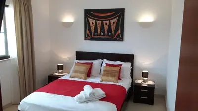 a bedroom with a bed with towels on it at Tortuga beach resort Penthouse apartment for holiday rental in Prainha