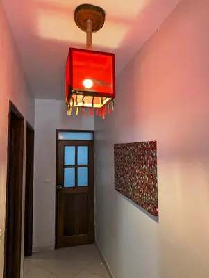 a chandelier hanging from a ceiling in a room at Apartment Funana Tarrafal in Tarrafal