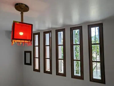 a row of windows in a room with a red light at Apartment Funana Tarrafal in Tarrafal