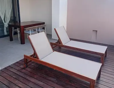 two chairs and a table in a room at Vila Cristina Alojamento, Praia Estoril, Boa Vista in Sal Rei