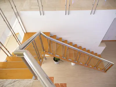 a staircase in a building with a potted plant at wonder of the archipelago in Praia