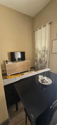 a room with a desk with a wooden box at City Center Mindelo 39 in Mindelo