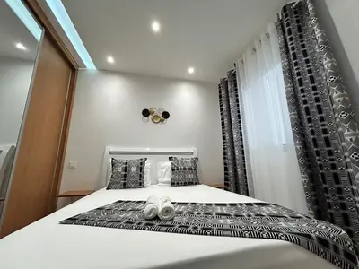 a bedroom with a bed and a window at Apartamento Batuku in Praia