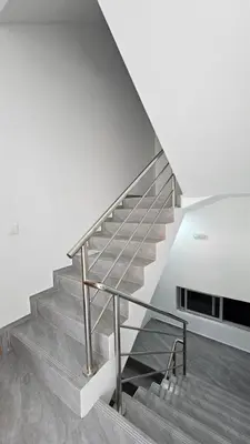 a staircase in a house with a metal railing at Apartamento Batuku in Praia