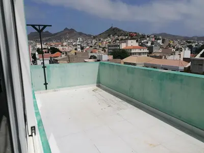 a view of a city from a balcony at STUDIO VUE MER - CASA da LUZ in Mindelo