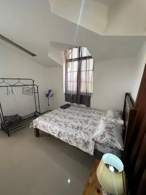 a bedroom with a bed and a window at Casa Mendes- Quarto individual in Praia
