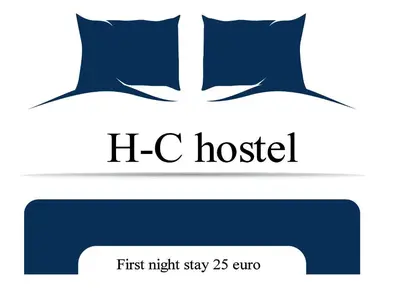 a blue pillow with the words h c hostel at Huizenmarkt Caboverde in Mindelo