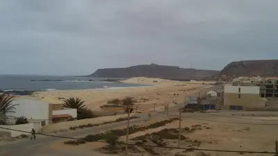 a view of a beach with buildings and the ocean at Casa Nostra in Sal Rei