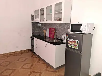 a small kitchen with a refrigerator and a microwave at Casa Nostra in Sal Rei