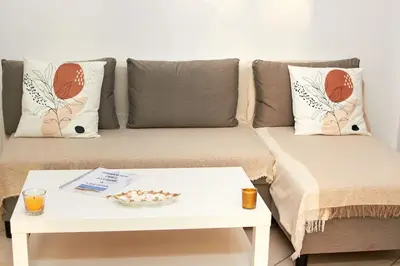 a living room with a couch with a table at Casa Irma in Santa Maria