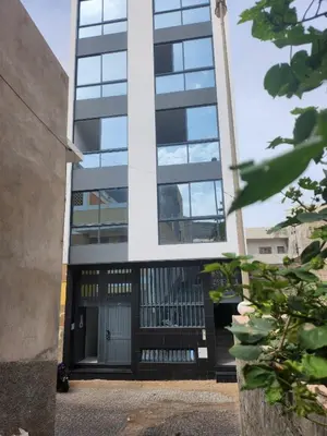 an external view of a building with a black door at Boa Mindelo City in Mindelo
