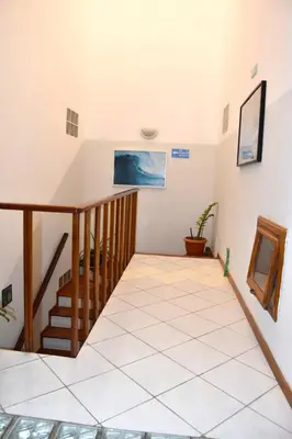 a staircase in a house with a stair case at Santa Maria Homely Flat in Santa Maria