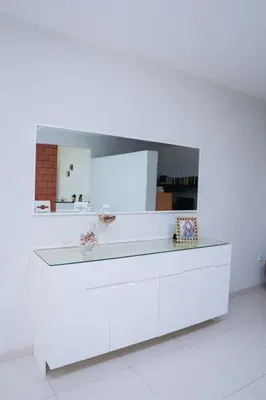 a white counter with a mirror on top of it at Nice And Modern with king size bed in Praia