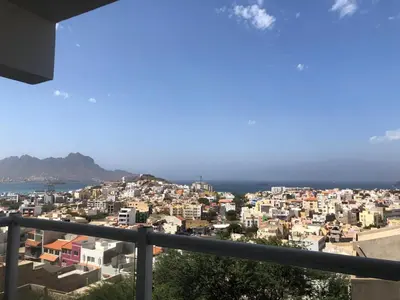 a view of a city from a balcony at Apartamento Oiá Mindelo in Mindelo