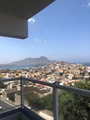 a view of a city from a balcony at Apartamento Oiá Mindelo in Mindelo