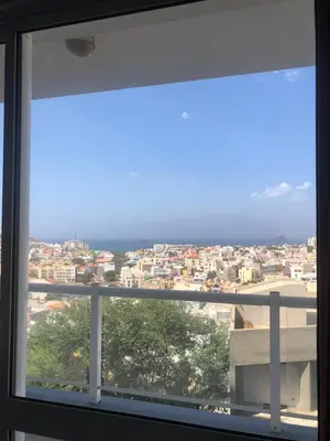 a view of a city from a window at Apartamento Oiá Mindelo in Mindelo