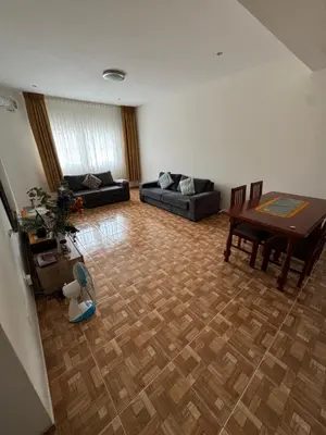 a living room with a couch and a table at Apartment T3 for rent in Porto Novo in Porto Novo