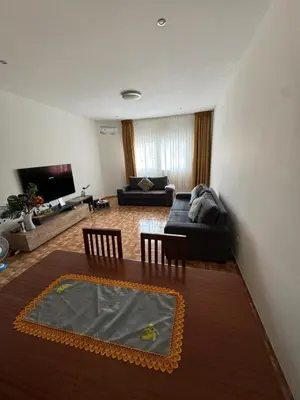a living room with a couch and a table at Apartment T3 for rent in Porto Novo in Porto Novo