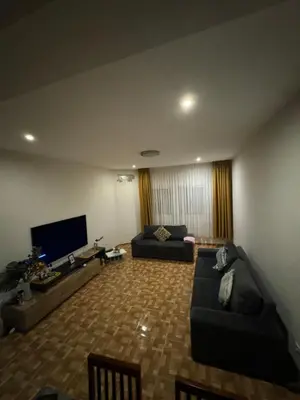 a living room with two couches and a flat screen tv at Apartment T3 for rent in Porto Novo in Porto Novo