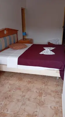a bedroom with a bed with a purple blanket at Edu Horizonte in Calheta de São Miguel
