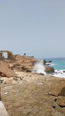 a rocky beach with waves crashing on the shore at Edu Horizonte in Calheta de São Miguel