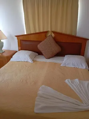 a bedroom with a large bed with two pillows at Edu Horizonte in Calheta de São Miguel