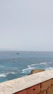 a view of the ocean with a boat in the water at Edu Horizonte in Calheta de São Miguel