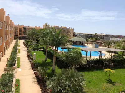 a view of a resort with a pool and palm trees at Tropical Issara Sal in Santa Maria