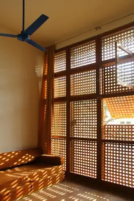 a room with a large window with blinds on it at Paz Apartment in Mindelo