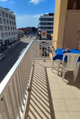 a blue table and chairs on the balcony of a building at Modern apartment in the Center in Sal Rei