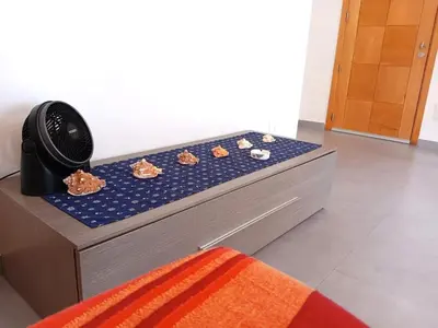 a bed with seashells on it in a room at Modern apartment in the Center in Sal Rei