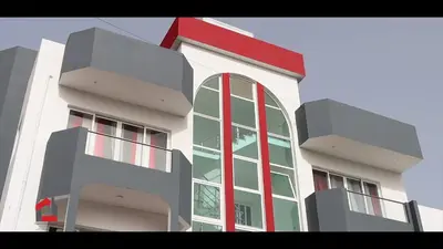a tall white building with a large window at Guest House Lina Elisa in Mindelo