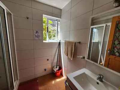 a bathroom with a sink and a window at SANDRO Paul Residenciel in Paul