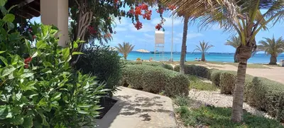 a resort with a beach and the ocean in the background at Appartamento t0 n 7 situato complesso turistico porto antico 2 in Santa Maria