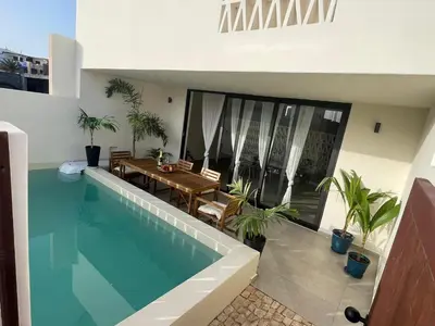 a swimming pool in the middle of a house at Lagoon Apartment mit Pool Boa Vista in Sal Rei