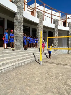 a group of people standing in front of a building at Cabo Verde Beach Sport Resort in Porto Novo