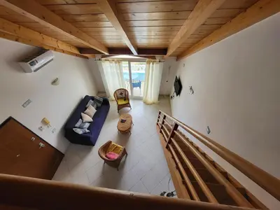 an overhead view of a living room with a couch at Soleil A9 in Santa Maria