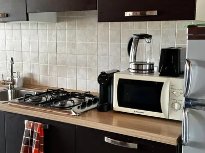 a microwave oven sitting on top of a kitchen counter at Soleil A9 in Santa Maria