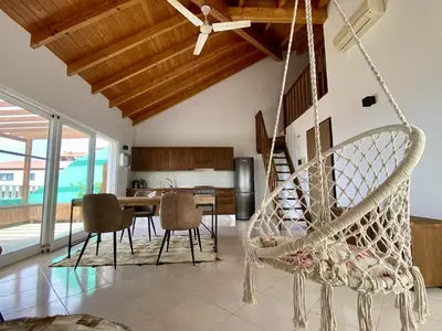 a room with a swing in a house at Estrela do Mar - Rooftop Ocean View in Santa Maria