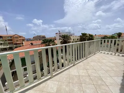 a balcony with a white railing on a building at Estrela do Mar - Rooftop Ocean View in Santa Maria