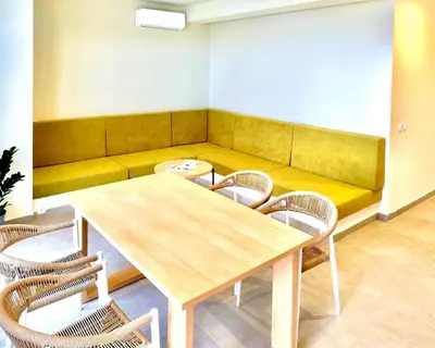 a conference room with a wooden table and chairs at Stylish Lagoon Paradise Apartment Boa Vista in Sal Rei